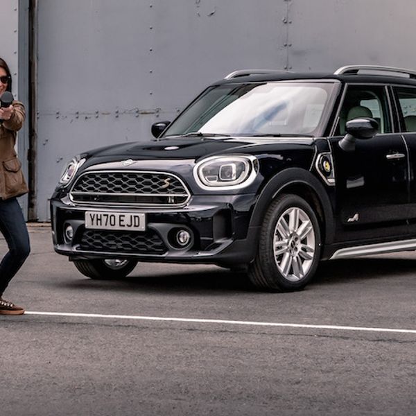 Ginny Buckley next to Mini PHEV with charging cable